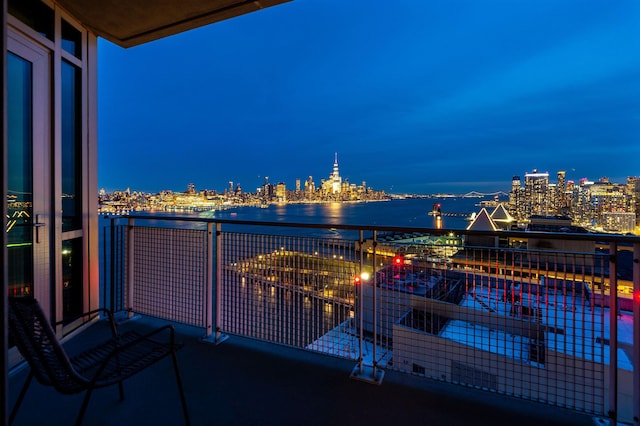 balcony featuring a water view