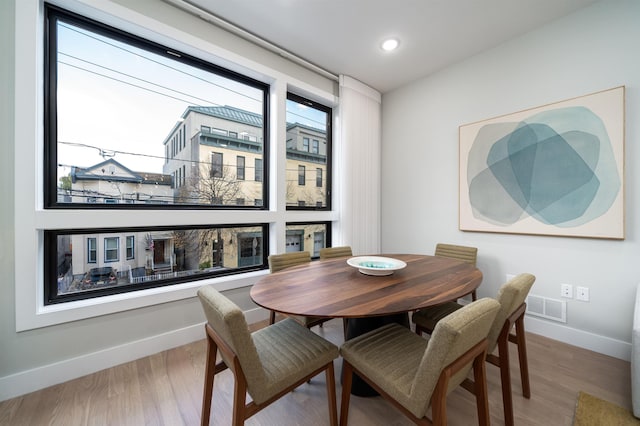 dining area with hardwood / wood-style flooring