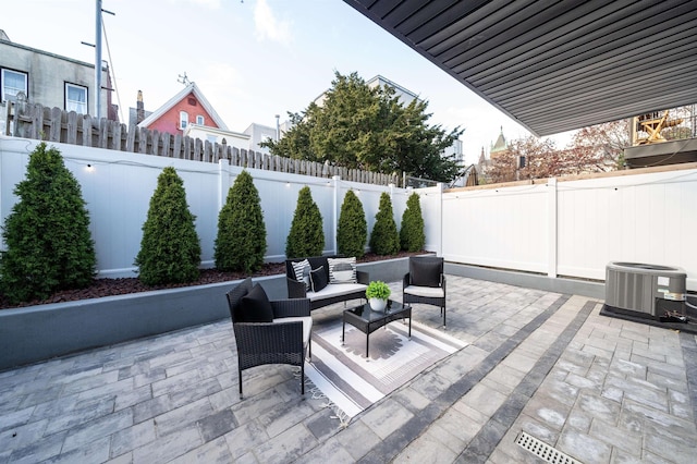 view of patio with an outdoor hangout area and central AC