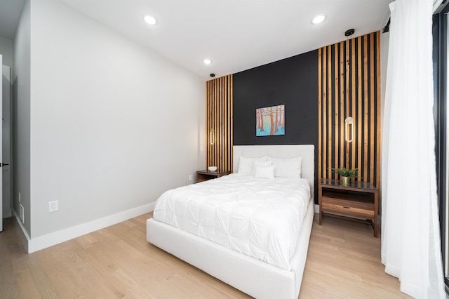 bedroom with hardwood / wood-style floors