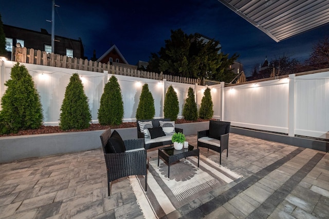 patio at night with an outdoor hangout area