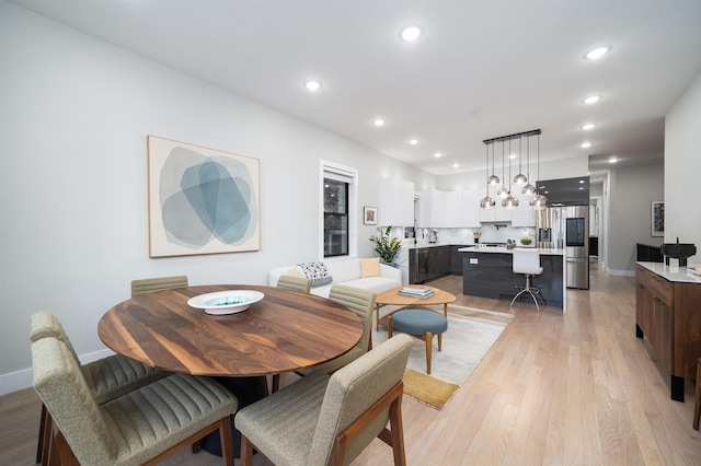 dining area with light hardwood / wood-style floors