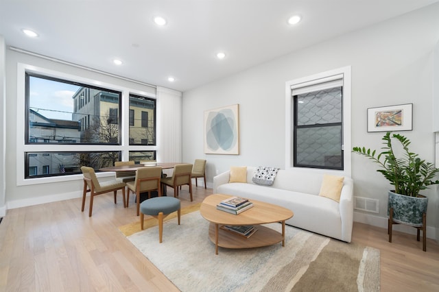 living room with light hardwood / wood-style floors