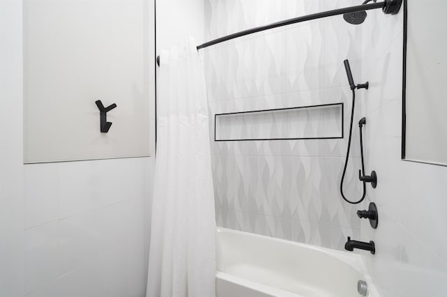 bathroom with shower / bath combo with shower curtain