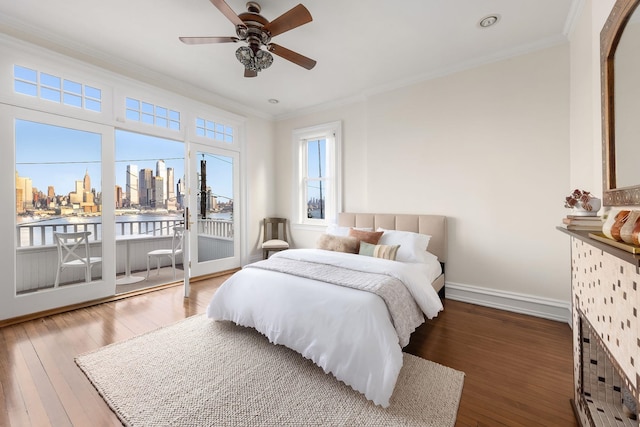 bedroom featuring crown molding, dark wood-type flooring, access to exterior, and ceiling fan