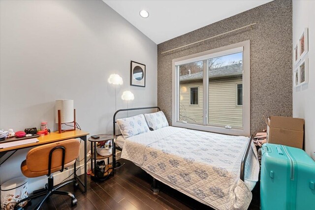 bedroom with recessed lighting and dark wood-style floors