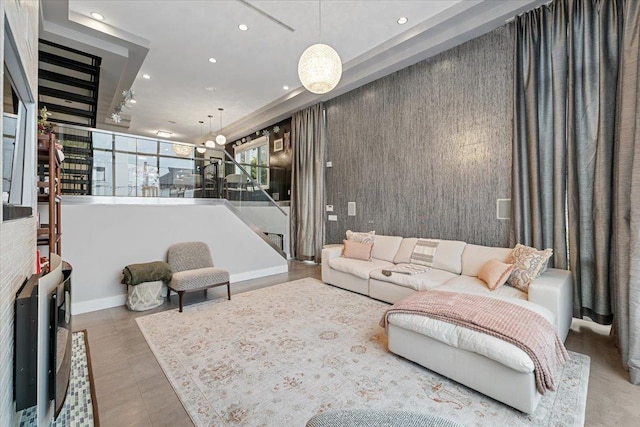 living room featuring recessed lighting and baseboards