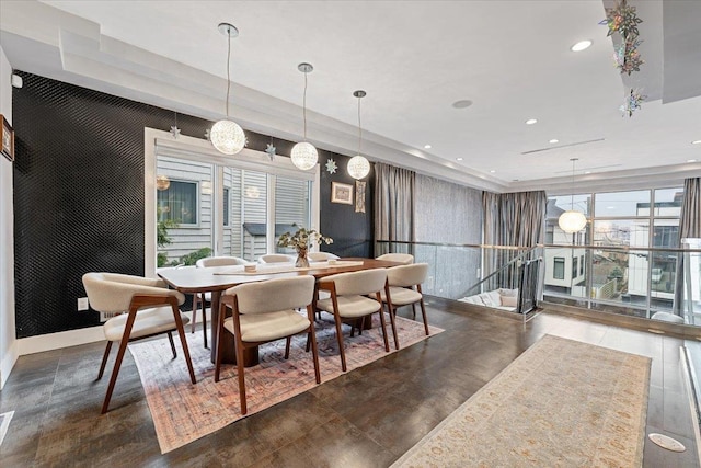 dining space featuring recessed lighting and baseboards