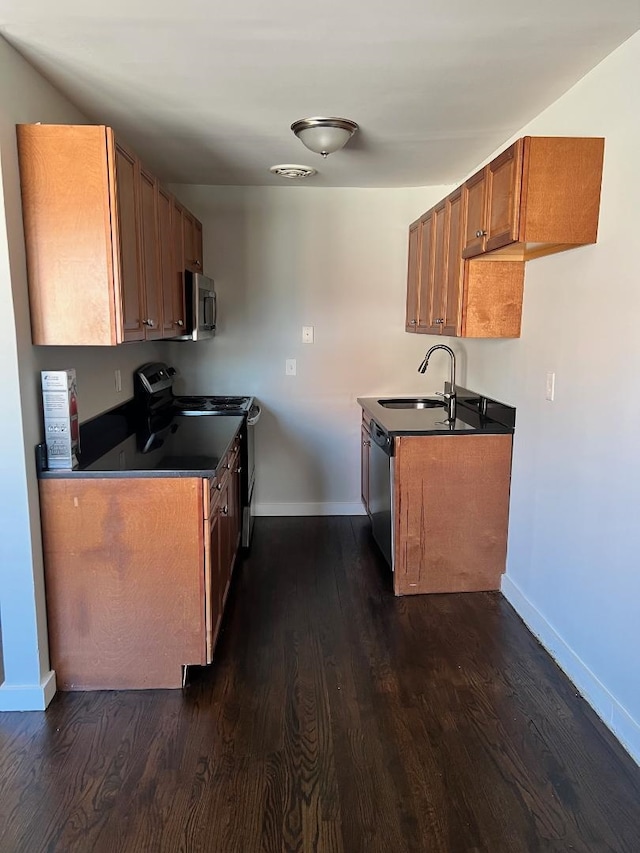 kitchen featuring sink, dark hardwood / wood-style floors, and appliances with stainless steel finishes