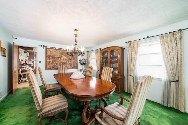 166 W 37th St, Bayonne, NJ 07086 - carpeted dining space with a chandelier, healthy amount of natural light, and a textured ceiling