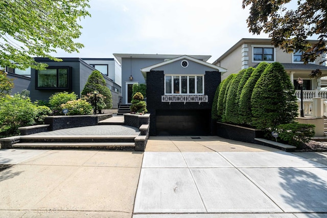166 W 37th St, Bayonne, NJ 07086 - view of front of home featuring a garage and driveway