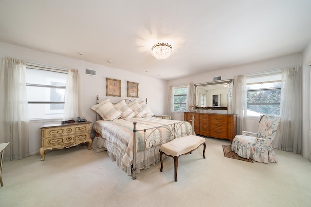 166 W 37th St, Bayonne, NJ 07086 - bedroom with light colored carpet and a chandelier