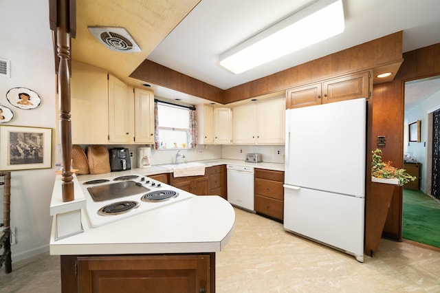 166 W 37th St, Bayonne, NJ 07086 - kitchen featuring white appliances, a peninsula, and light countertops
