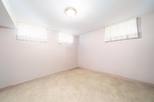 166 W 37th St, Bayonne, NJ 07086 - below grade area featuring baseboards and light colored carpet
