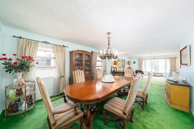 166 W 37th St, Bayonne, NJ 07086 - dining room with light carpet, a chandelier, and a textured ceiling
