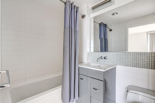 2 2nd St Unit 3805-1, Jersey City, NJ 07302 - bathroom with toilet, shower / tub combo, vanity, decorative backsplash, and tile walls