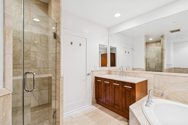 8100 River Rd Unit 0107, North Bergen, NJ 07047 - bathroom featuring a bath, vanity, a stall shower, marble finish flooring, and recessed lighting
