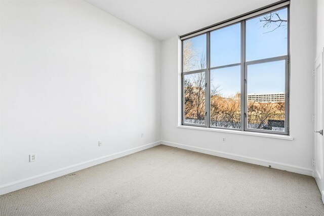 8100 River Rd Unit 0107, North Bergen, NJ 07047 - empty room featuring plenty of natural light, baseboards, and carpet floors