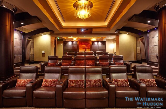 8100 River Rd Unit 0107, North Bergen, NJ 07047 - home theater room featuring a raised ceiling, arched walkways, and decorative columns