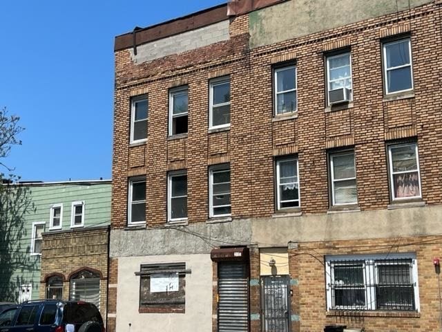 view of building exterior with cooling unit