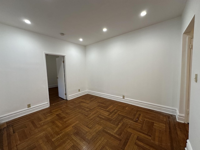 empty room featuring dark parquet floors