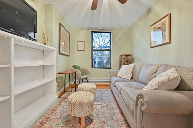 living room featuring light hardwood / wood-style floors, ceiling fan, and a baseboard radiator