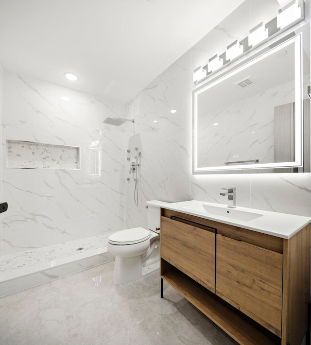 133 Clifton Pl Unit 2, Jersey City, NJ 07304 - full bath featuring vanity, marble tiled floors, a marble finish shower, and tile walls