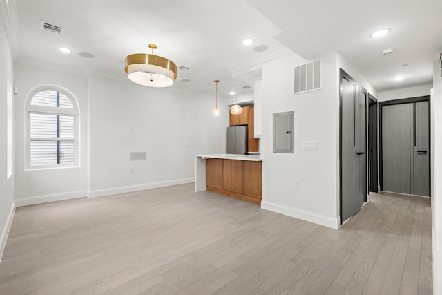 133 Clifton Pl Unit 2, Jersey City, NJ 07304 - unfurnished living room with light wood-type flooring, electric panel, ornamental molding, and recessed lighting