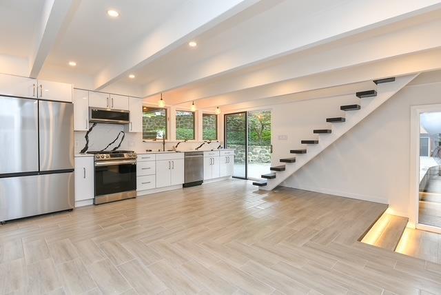 203 Stanhope Rd, Sparta, NJ 07871 - kitchen with stainless steel appliances, white cabinetry, beamed ceiling, recessed lighting, and light countertops
