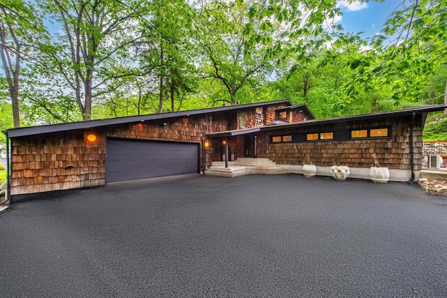 203 Stanhope Rd, Sparta, NJ 07871 - view of front facade featuring a garage and asphalt driveway