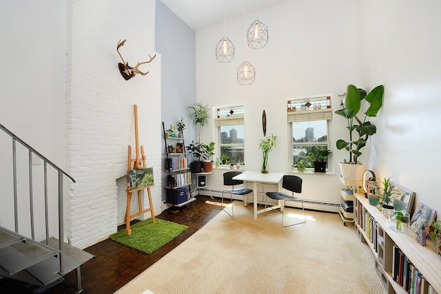 212 9th St Unit 4B, Jersey City, NJ 07302 - sitting room featuring a towering ceiling, wood finished floors, stairway, and a baseboard heating unit