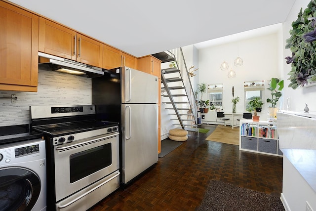 212 9th St Unit 4B, Jersey City, NJ 07302 - kitchen with washer / clothes dryer, electric stove, under cabinet range hood, freestanding refrigerator, and tasteful backsplash