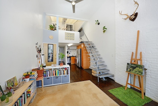 212 9th St Unit 4B, Jersey City, NJ 07302 - staircase with a high ceiling, wood finished floors, a ceiling fan, and brick wall