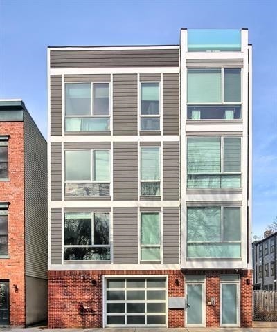414 1st St Unit 1, Jersey City, NJ 07302 - view of property featuring an attached garage