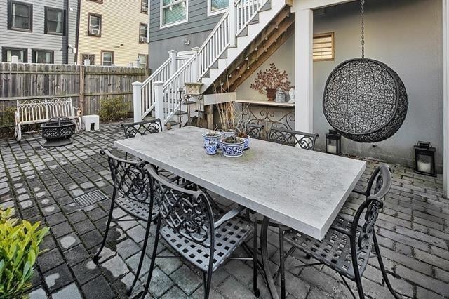 414 1st St Unit 1, Jersey City, NJ 07302 - view of patio with stairway, a fire pit, and outdoor dining space