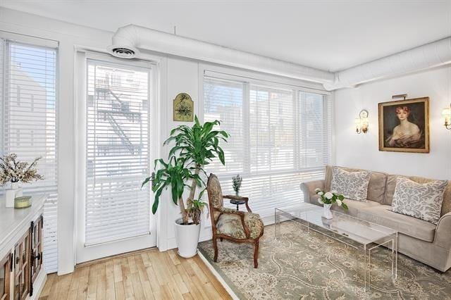 414 1st St Unit 1, Jersey City, NJ 07302 - living room with plenty of natural light and light wood-style flooring