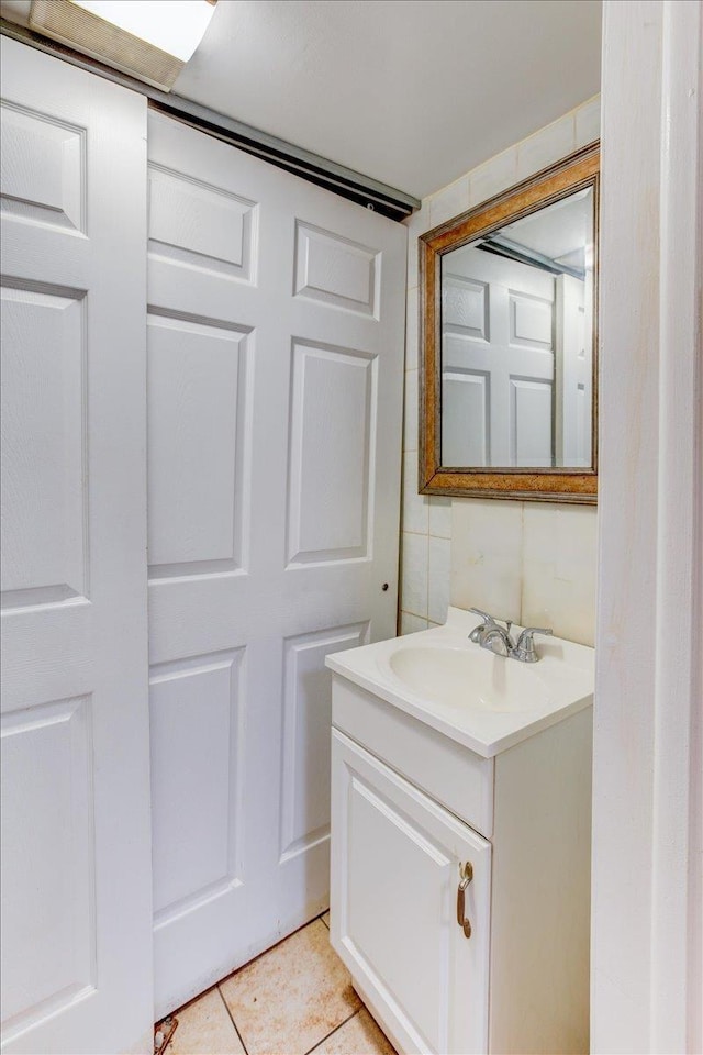 bathroom with tile patterned flooring and vanity