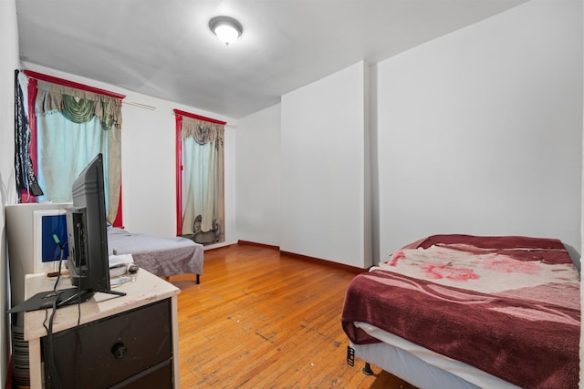 bedroom with light hardwood / wood-style flooring