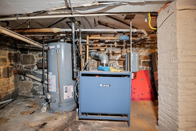 utility room featuring water heater