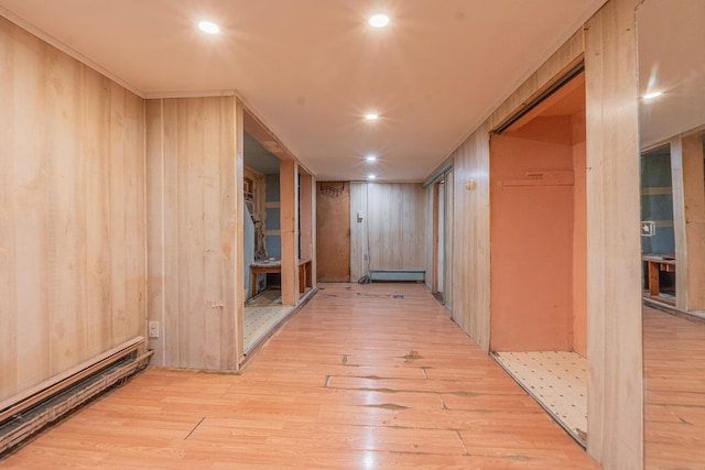 509 81st St, North Bergen, NJ 07047 - corridor with a baseboard radiator, light wood-type flooring, wooden walls, and recessed lighting