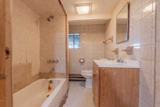 509 81st St, North Bergen, NJ 07047 - full bath with tile walls, toilet, vanity, tile patterned flooring, and shower / bath combination