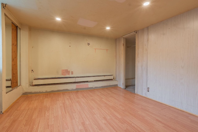 509 81st St, North Bergen, NJ 07047 - unfurnished room featuring wood finished floors, a baseboard heating unit, and recessed lighting
