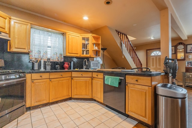 509 81st St, North Bergen, NJ 07047 - kitchen featuring stainless steel appliances, a peninsula, backsplash, plenty of natural light, and recessed lighting