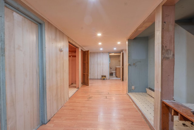 509 81st St, North Bergen, NJ 07047 - corridor with light wood-style flooring, recessed lighting, a baseboard heating unit, and wood walls