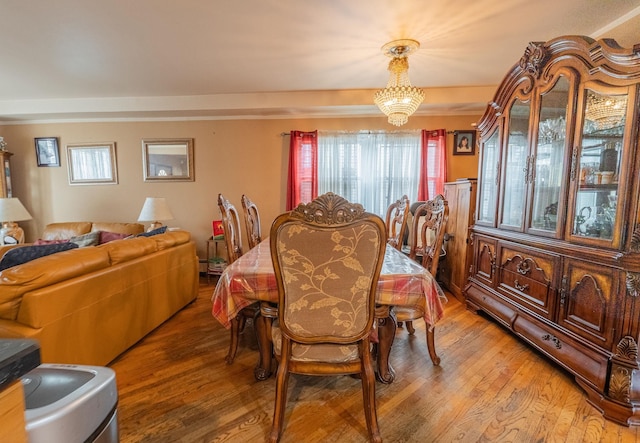 509 81st St, North Bergen, NJ 07047 - dining room featuring a chandelier and light wood finished floors