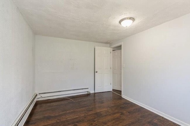 unfurnished room featuring baseboards, baseboard heating, a baseboard heating unit, and wood finished floors