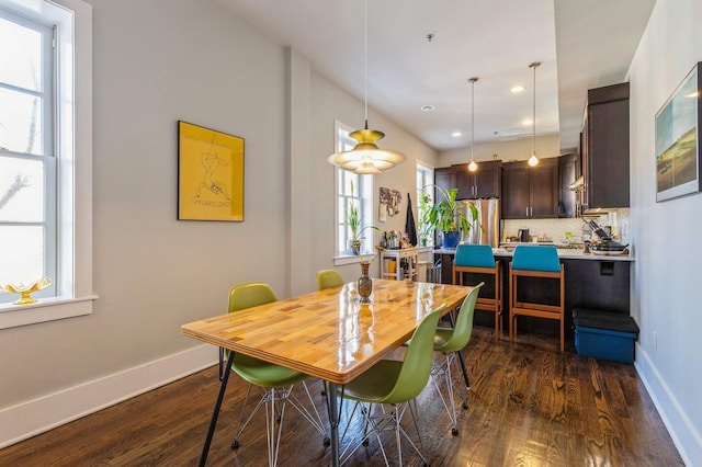 dining space with dark wood-style floors, recessed lighting, and baseboards