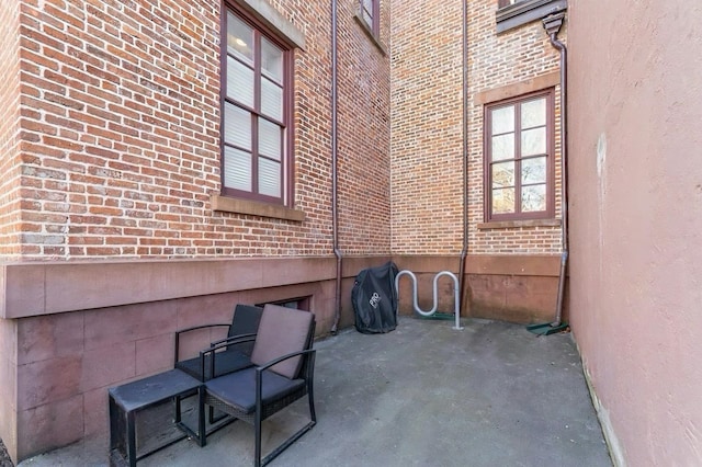 view of side of property with brick siding