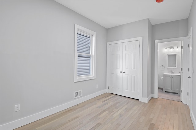 95 Claremont Ave, Jersey City, NJ 07304 - unfurnished bedroom with light wood-type flooring and a closet