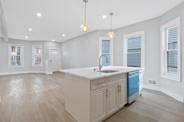 95 Claremont Ave, Jersey City, NJ 07304 - kitchen featuring dishwashing machine, light wood-style flooring, light stone countertops, decorative light fixtures, and recessed lighting
